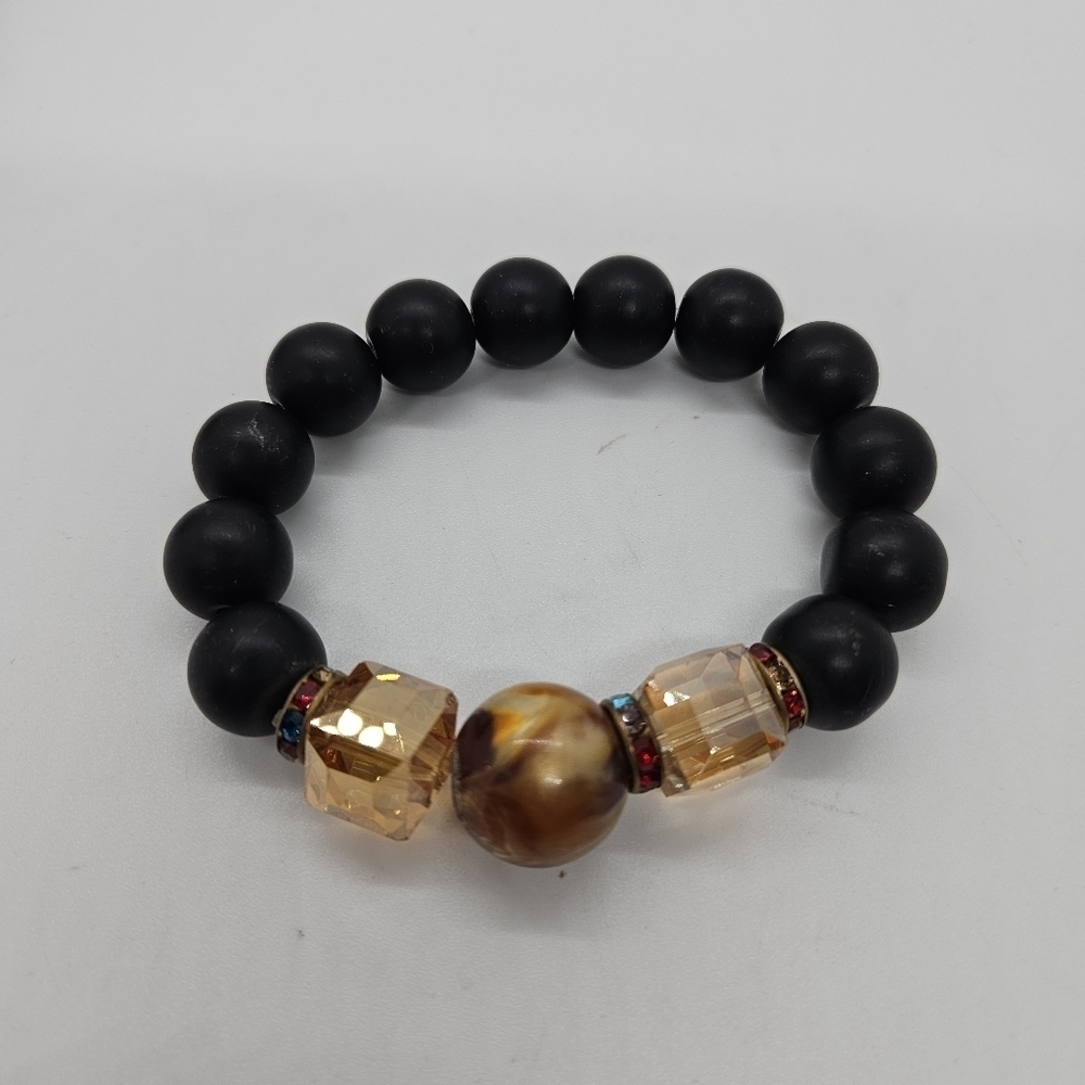 chunky black beaded stretch bracelet with orange crystal and brown swirl beads